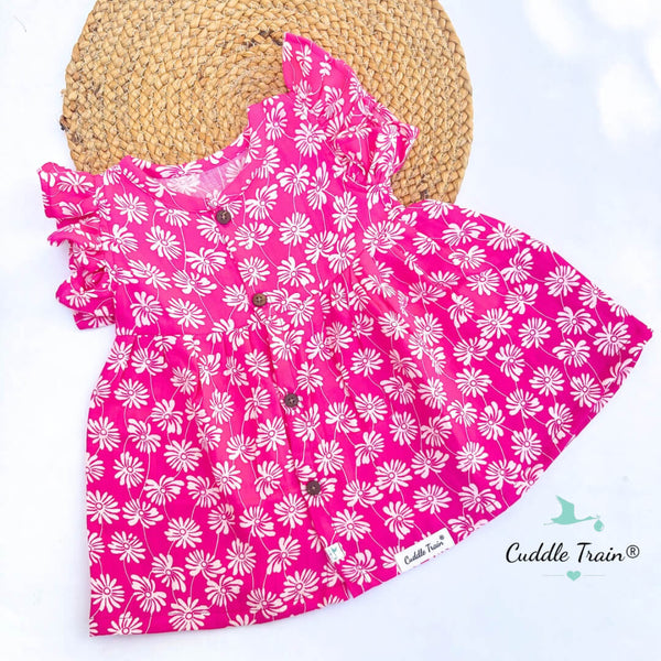 Pink dress with white floral pattern on a white background