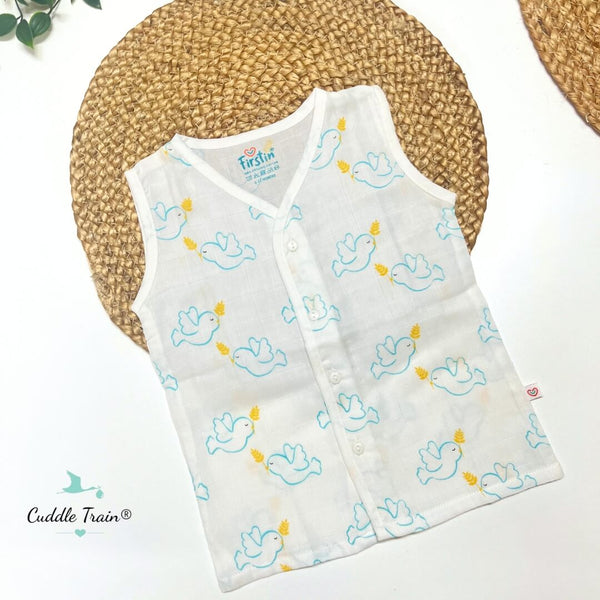 Baby vest with duck pattern on a white surface