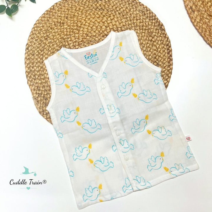 Baby vest with duck pattern on a white surface