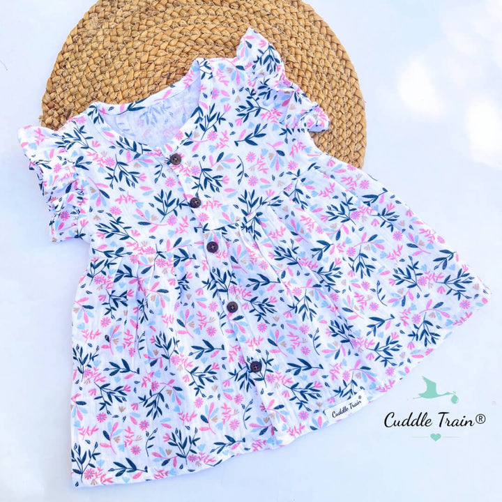 Floral dress with ruffled sleeves on a white background, branded 'Cuddle Train'.