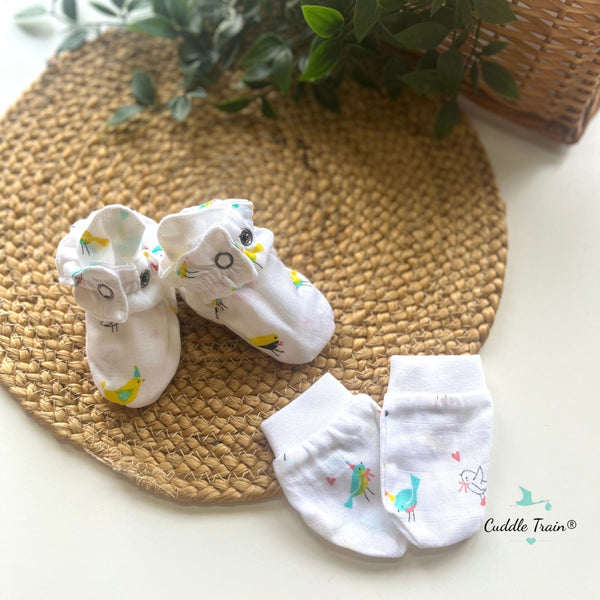 Baby socks with cartoon designs on a woven mat