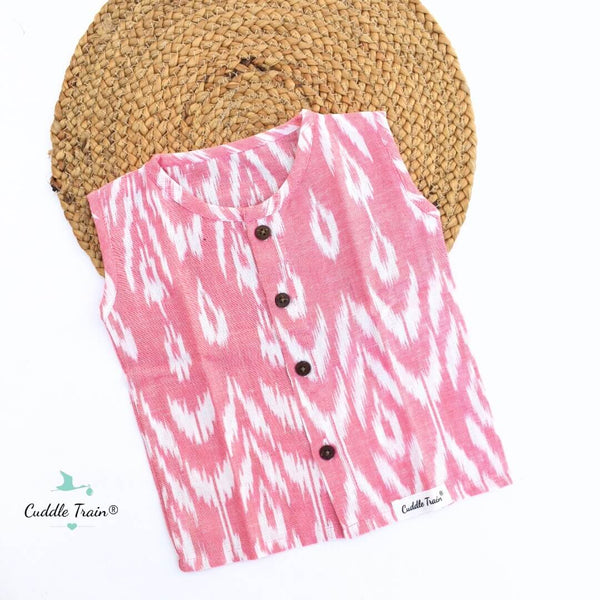 Pink and white patterned shirt with buttons on a white background