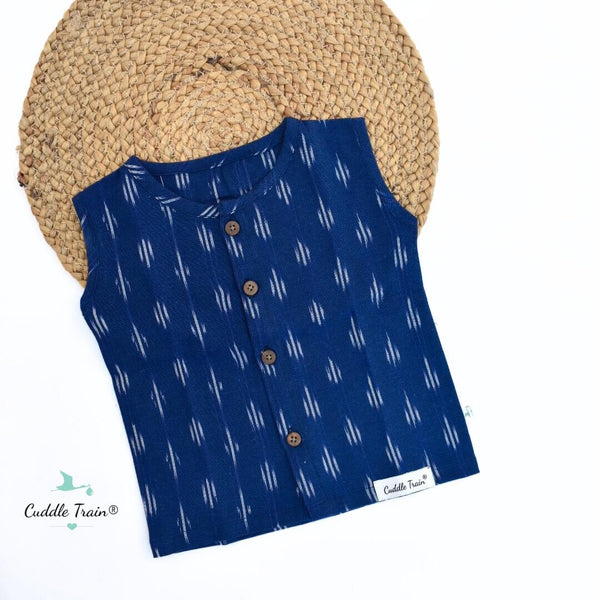 Blue sleeveless shirt with white pattern on a white background, featuring the Cuddle Train brand.