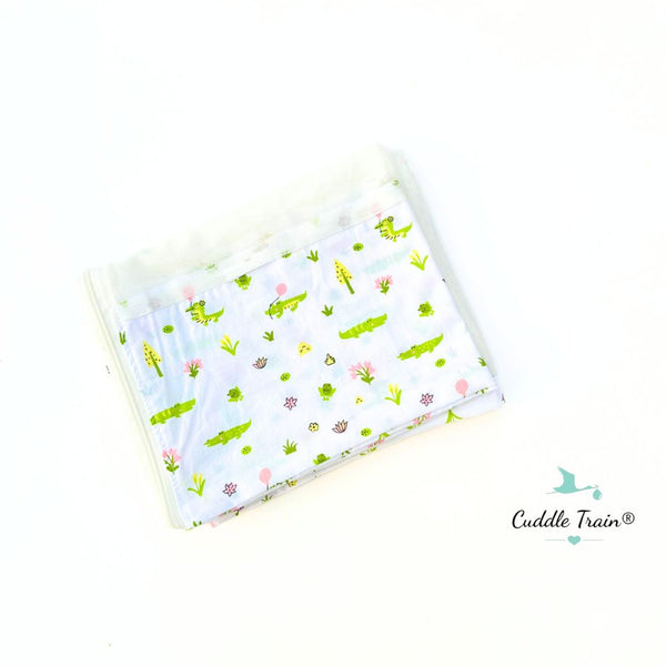 Mosquito net with alligator pattern on a white background, featuring the brand 'Cuddle Train'.