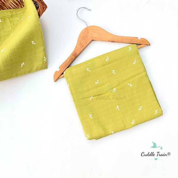 Green fabric pouch with white patterns on a wooden hanger against a white background