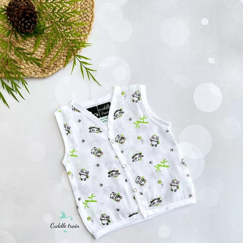 baby vests with panda pattern on a white surface with decorative elements.