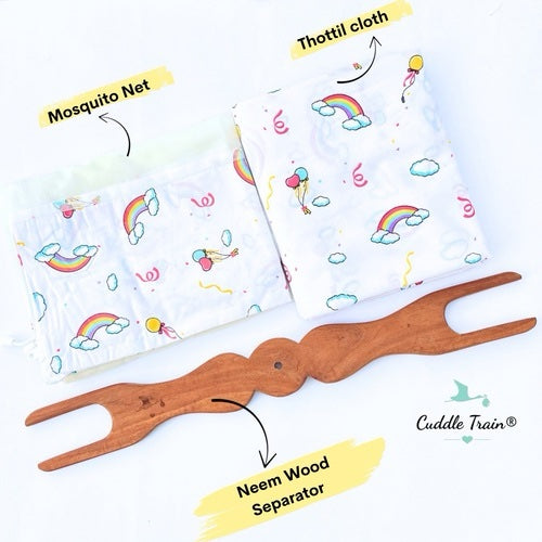 Mosquito net, Thottil cloth with rainbow design, and Neem wood separator on a white background.