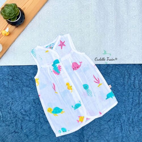 Children's sleeveless dress with animal prints on a textured surface