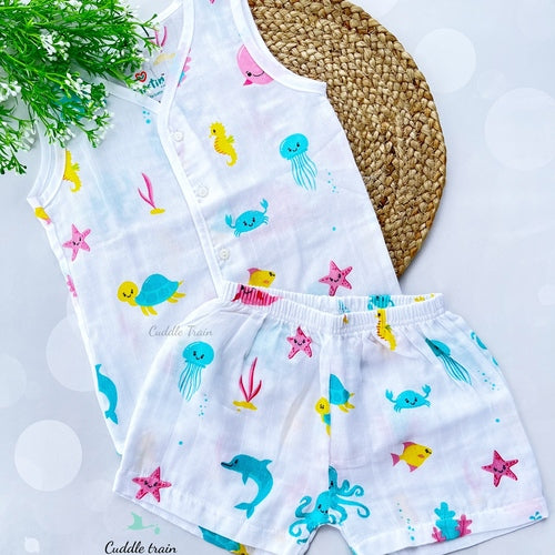 Children's outfit with sea-themed pattern on a white background