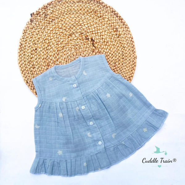 Light blue dress with star patterns on a white background
