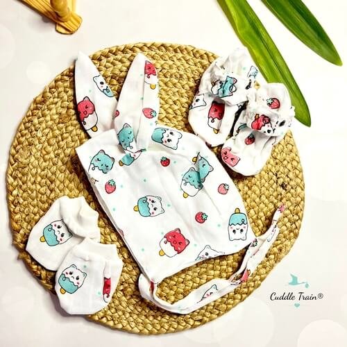 Set of baby accessories with ice cream and bear pattern on a woven mat