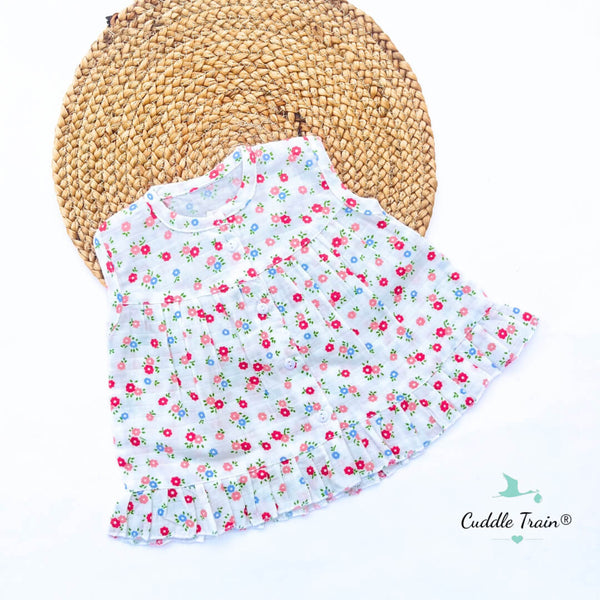 Floral baby bib on a white background with 'Cuddle Train' branding.