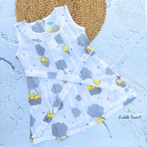 Baby outfit with cartoon design on a textured blue surface